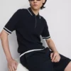 El polo con cremallera texturizada de The Edit