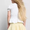 1,5-9 años | Blusa con peplum fruncido