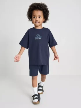 1,5-9 años | Conjunto de camiseta y pantalones cortos con estampado tropical flocado