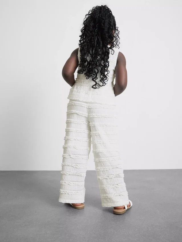 1,5-9 años | Pantalones con volantes y textura arrugada