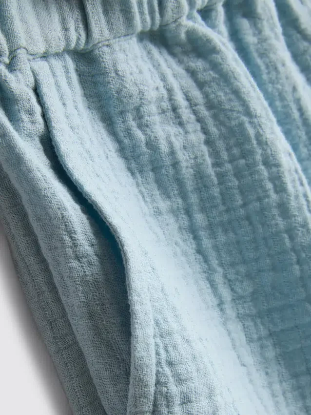 1,5-9 años | Pantalones cortos con ribete festoneado y ojales