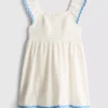 1-9 años | Vestido tipo smock con ribete ondulado