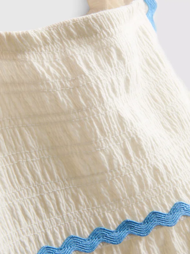 1-9 años | Vestido tipo smock con ribete ondulado