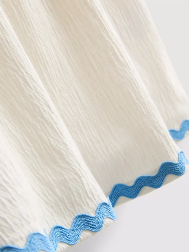 1-9 años | Vestido tipo smock con ribete ondulado