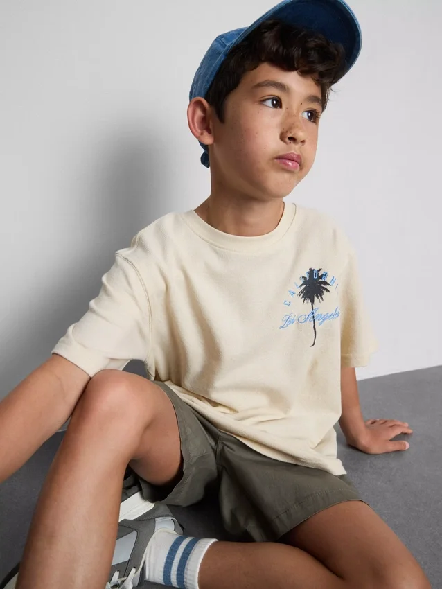 7-15 años | Camisa texturizada con estampado de palmeras