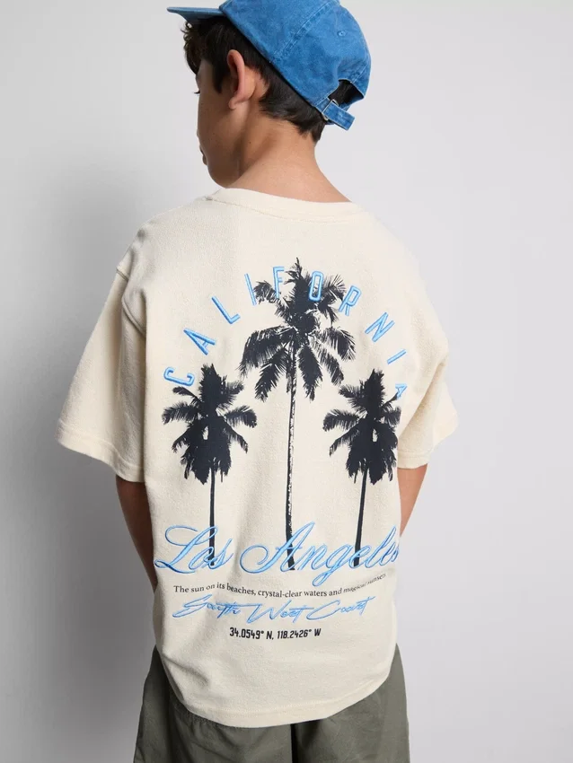 7-15 años | Camisa texturizada con estampado de palmeras