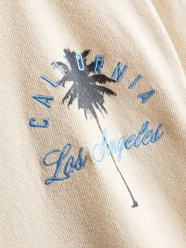 7-15 años | Camisa texturizada con estampado de palmeras