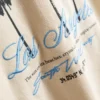 7-15 años | Camisa texturizada con estampado de palmeras