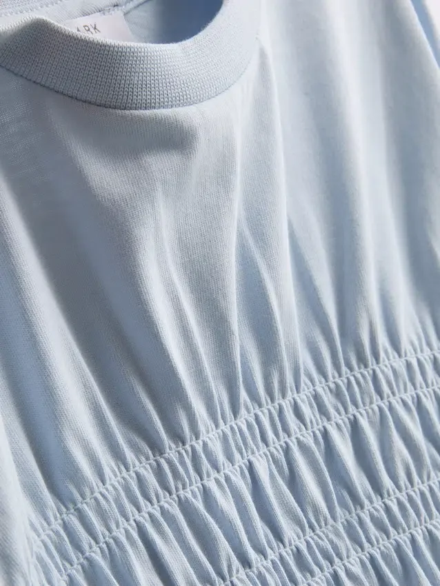 7-15 años | Camiseta con peplum fruncido