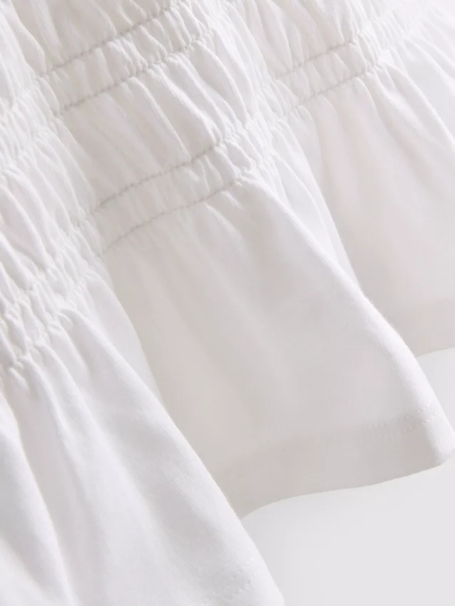 7-15 años | Camiseta con peplum fruncido