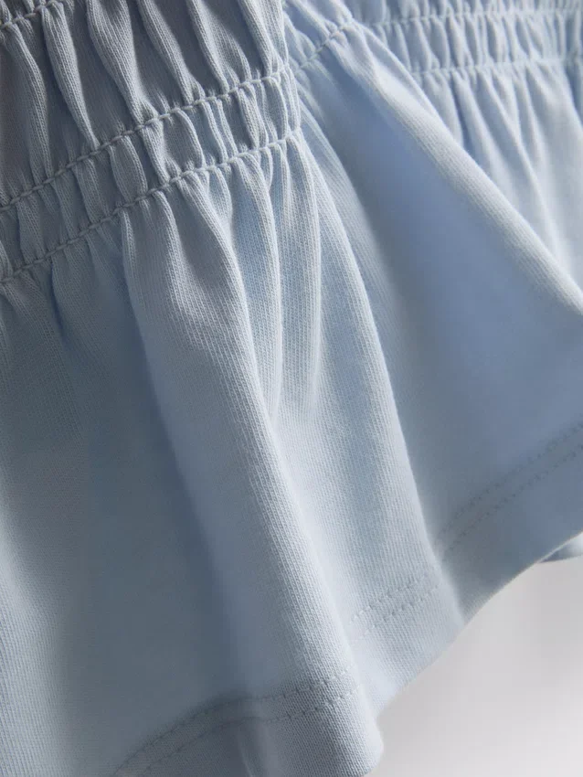 7-15 años | Camiseta con peplum fruncido
