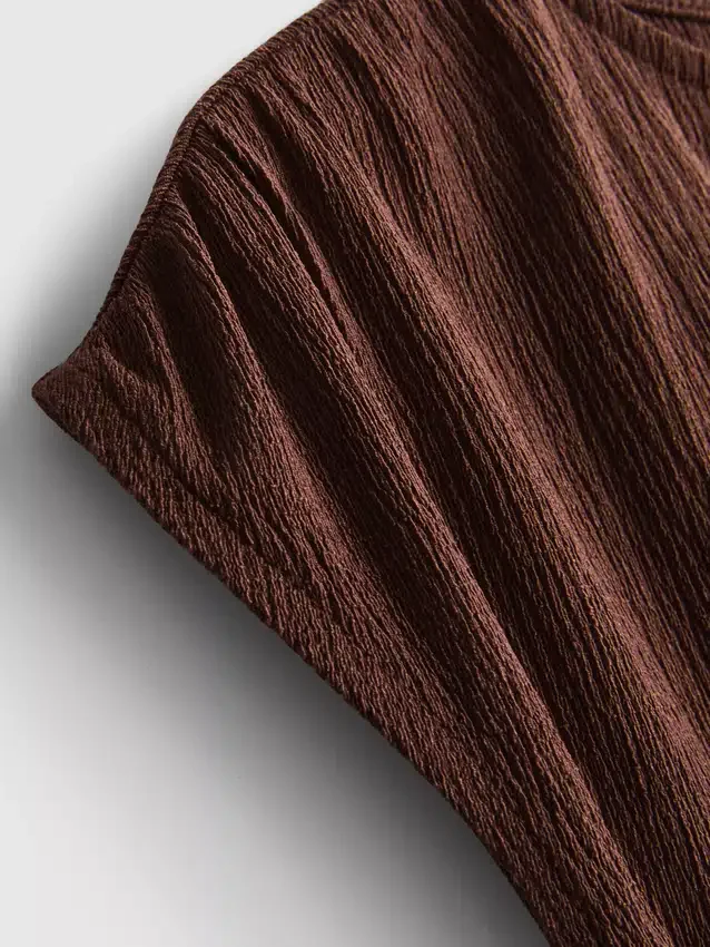 Blusa asimétrica arrugada