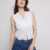 Blusa con broderie de algodón y lazo en el frente