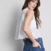 Blusa con broderie de algodón y lazo en el frente