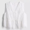 Blusa con broderie de algodón y lazo en el frente