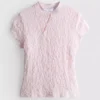 Blusa con cuello alto texturizado