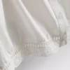 Blusa corta de popelín de algodón con mangas abullonadas