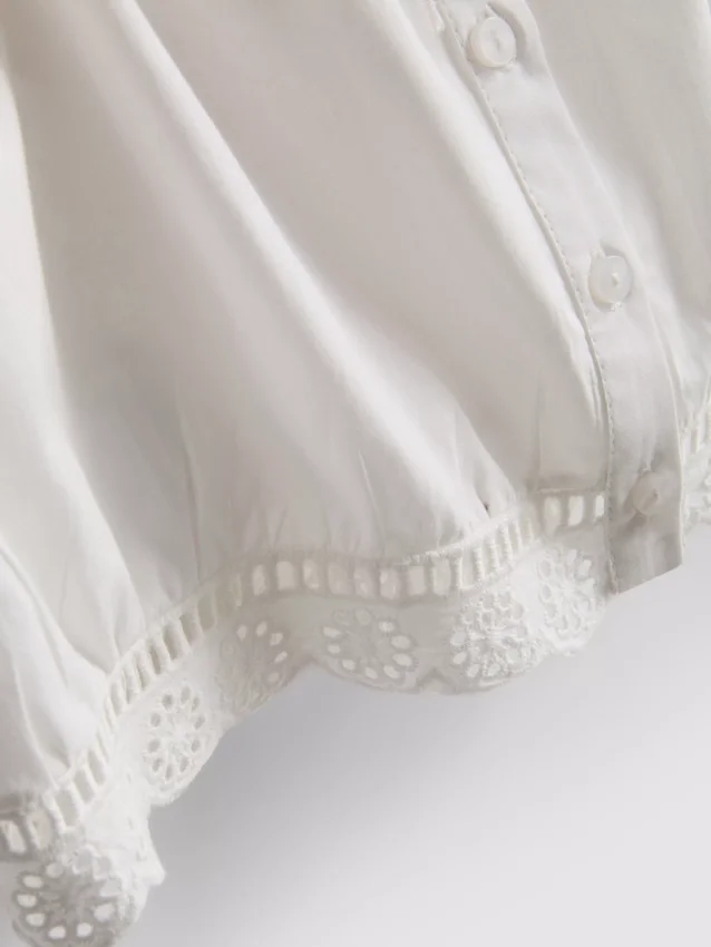 Blusa corta de popelín de algodón con mangas abullonadas
