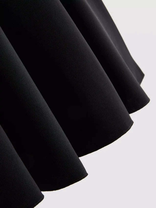 Blusa de crepé con peplum y escote corazón