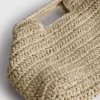 Bolso cruzado tejido de Paula Echevarría
