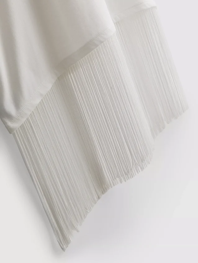 Camisa de algodón asimétrica con flecos
