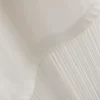 Camisa de algodón asimétrica con flecos