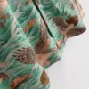 Camisa de pantalón corto con botones y estampado de pájaros