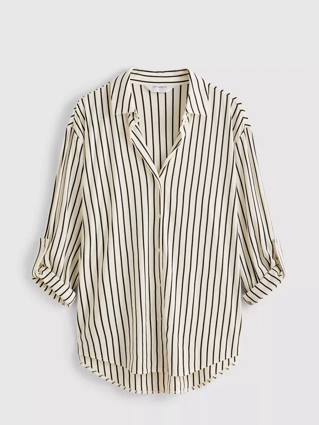 Camisa holgada con botones y dobladillo curvo