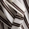 Camisa holgada con botones y dobladillo curvo