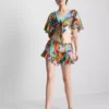 Camisas cortas con estampado tropical y lazo