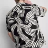 Camisas de manga corta con estampado abstracto de hojas