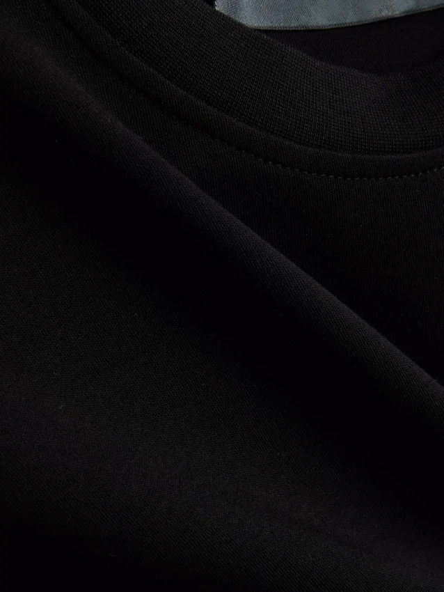 Camiseta corta sin mangas con hombreras