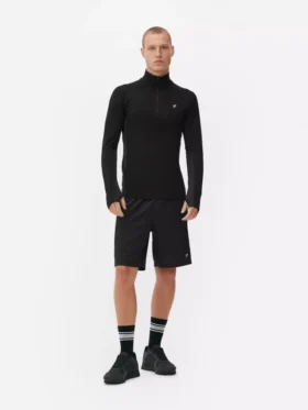 Camiseta deportiva de manga larga con cremallera de un cuarto
