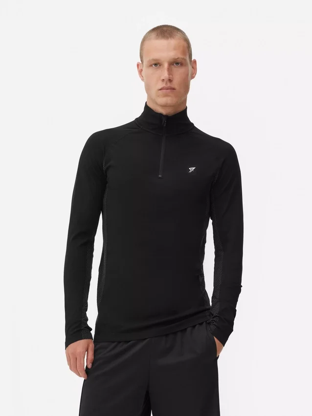 Camiseta deportiva de manga larga con cremallera de un cuarto