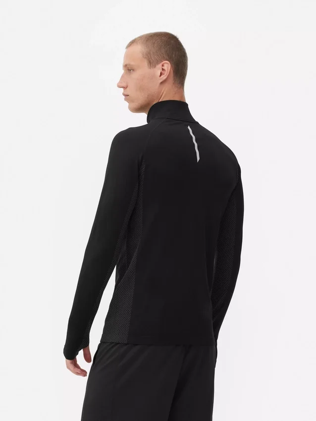 Camiseta deportiva de manga larga con cremallera de un cuarto