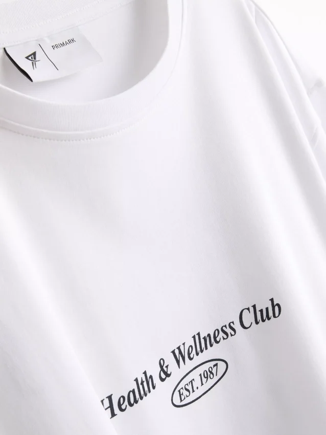 Camiseta deportiva holgada de algodón con diseño gráfico