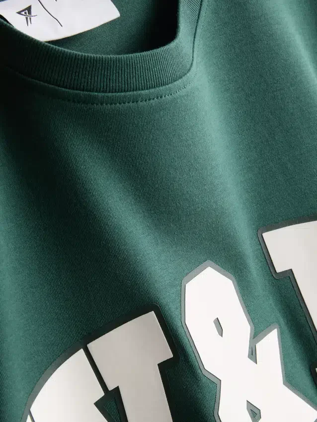 Camiseta deportiva holgada de algodón con diseño gráfico