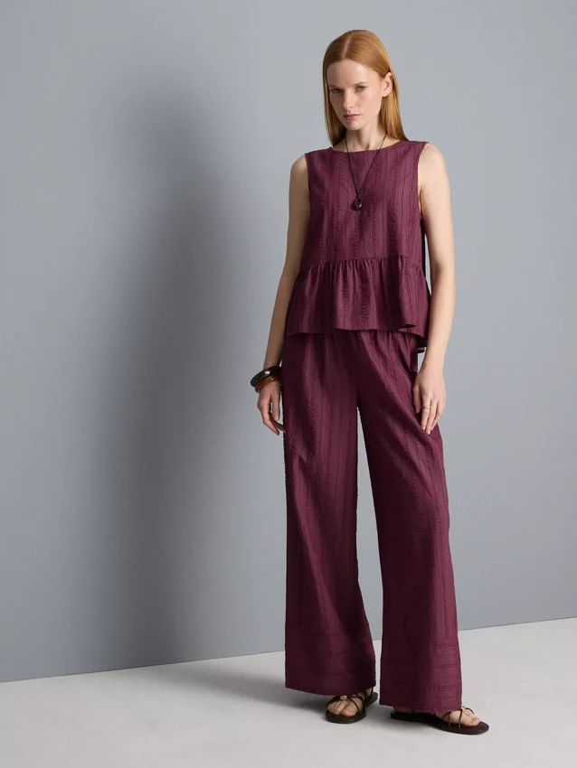 Camiseta sin mangas con dobladillo peplum a rayas