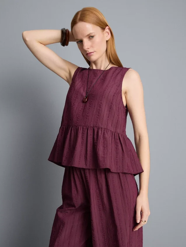 Camiseta sin mangas con dobladillo peplum a rayas