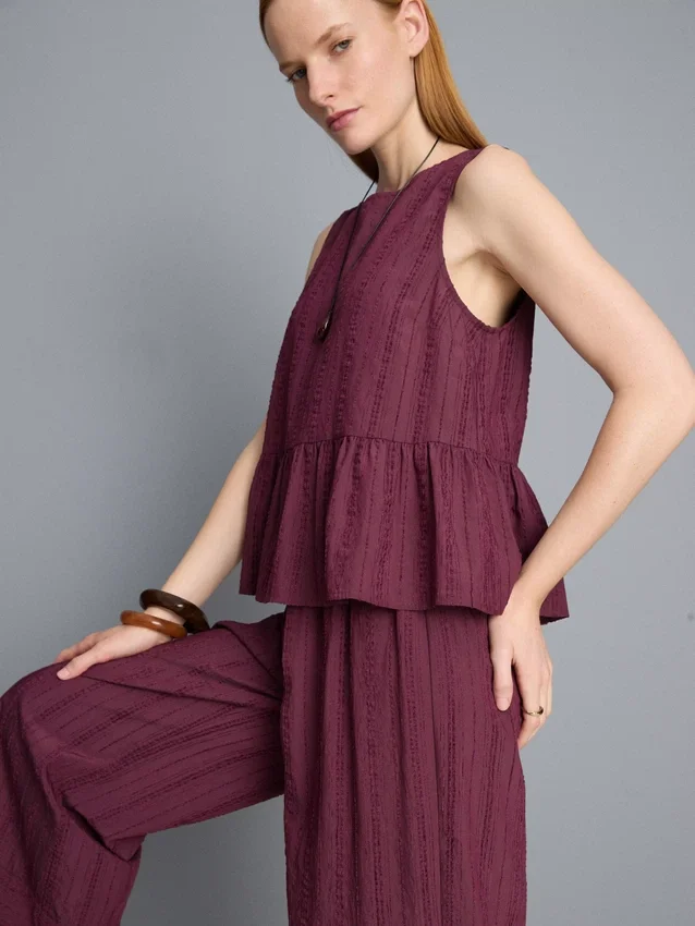 Camiseta sin mangas con dobladillo peplum a rayas