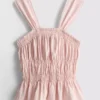 Camiseta sin mangas con dobladillo tipo peplum fruncido