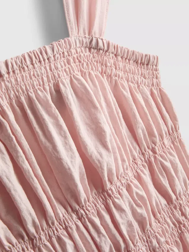 Camiseta sin mangas con dobladillo tipo peplum fruncido