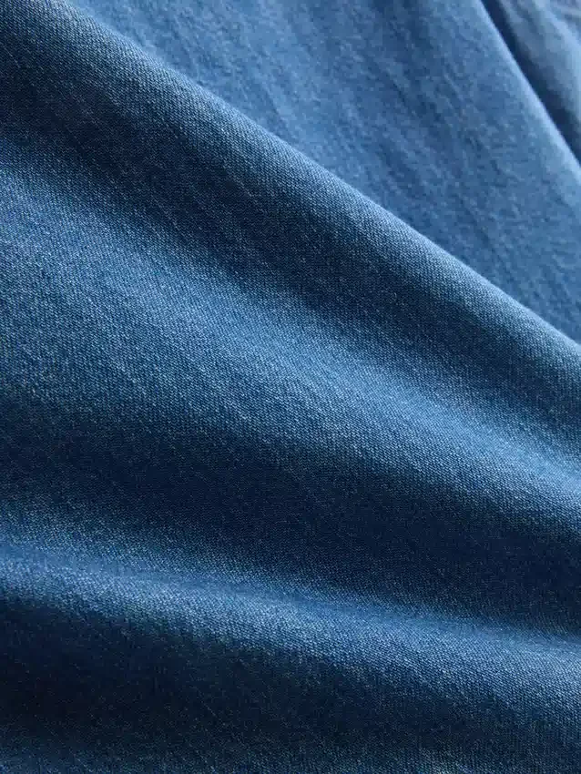 Camiseta sin mangas corta de denim de algodón con volantes