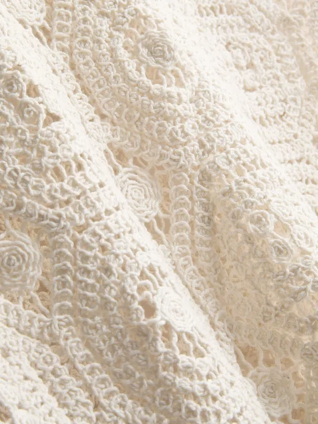 Camiseta sin mangas de crochet con lazo lateral