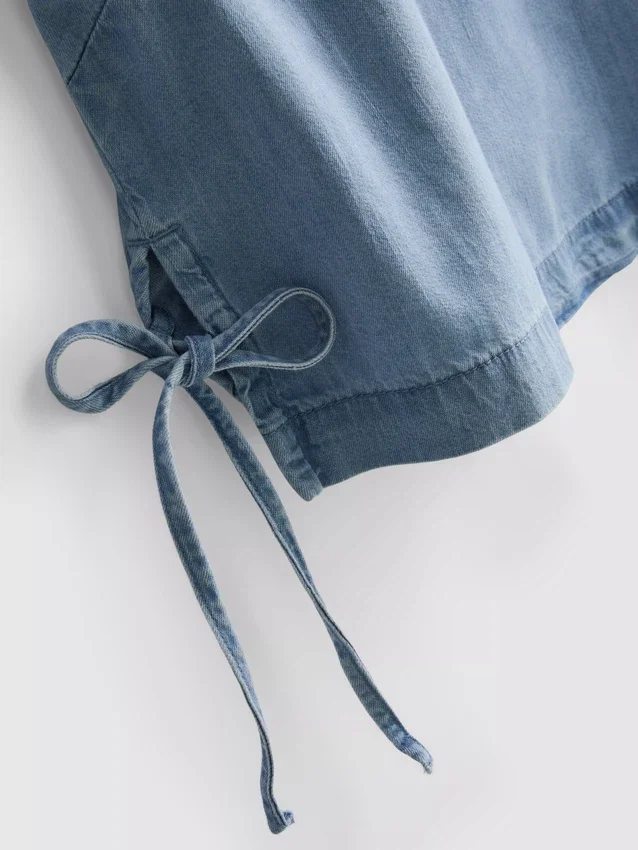 Camiseta sin mangas de mezclilla de algodón con lazos a los lados
