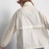 Chaqueta impermeable plegable con cremallera