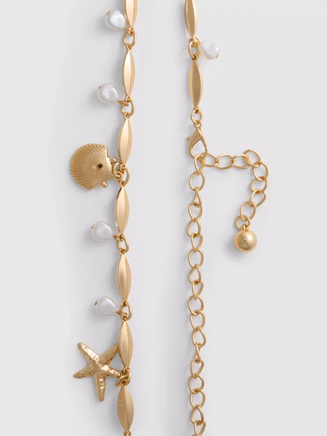 Cinturón con cadena y dije de concha