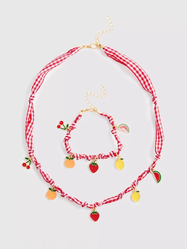Conjunto de joyas con dijes de frutas