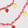 Conjunto de joyas con dijes de frutas