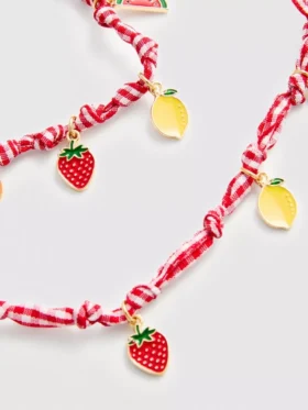 Conjunto de joyas con dijes de frutas